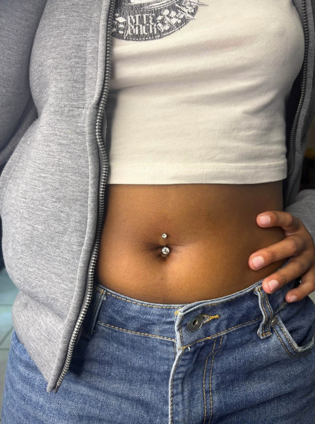 Double-gem navel piercing performed at Professional Black Ink, Rustenburg